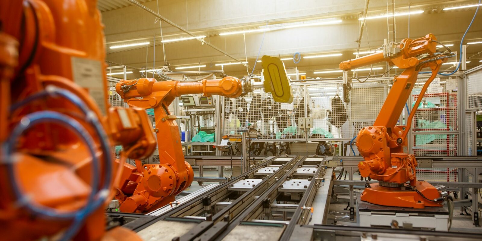 a factory filled with lots of orange machines